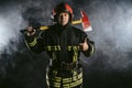 Strong fireman isolated in smoky background