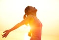 Strong confident woman open arms on beach