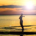 A strong confident woman open arms to sunset Royalty Free Stock Photo