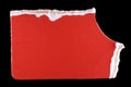 Macro photograph of a bright red torn paper fragment on a clean black background. Royalty Free Stock Photo