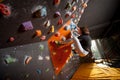 Strong female climber on boulder climbing wall indoor Royalty Free Stock Photo