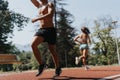 Strong and Fit Athletes Enjoying Outdoor Training in Park During Summertime