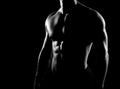 Strong, fit and sporty bodybuilder man in grayscale