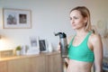 Woman drinking water after doing fitness exercises at home Royalty Free Stock Photo