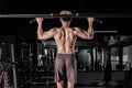 Strong fitness man doing arm workout in the gym Royalty Free Stock Photo