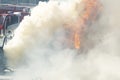 Strong flames from burning car on background of a fire truck. firefighters training Royalty Free Stock Photo