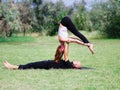 Morning yoga in the city green park. A beautiful couple holds a yoga class Royalty Free Stock Photo