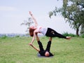 Morning yoga in the city green park. A beautiful couple holds a yoga class Royalty Free Stock Photo