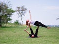 Morning yoga in the city green park. A beautiful couple holds a yoga class Royalty Free Stock Photo