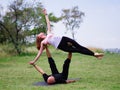 Morning yoga in the city green park. A beautiful couple holds a yoga class Royalty Free Stock Photo