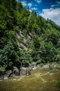 Strong flow and boiling of water in mountain river with splashes. Fast stream in the Carpathians, Ukraine. Stones in a mountain Royalty Free Stock Photo