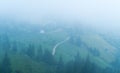 Strong house in fog in the mountains Royalty Free Stock Photo