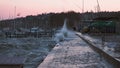 A strong gale force wind crashes waves