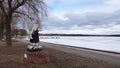 Strong girl statue in front of Saxviken part of lake Siljan in Mora, Sweden Royalty Free Stock Photo
