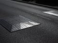 strong graphic close-up of road speed bumps