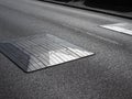 strong graphic close-up of road speed bumps