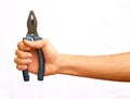 Hand hold the blue pliers with .jisolated backgroundp