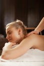 Tranquil blonde lady visiting SPA-complex and getting massage