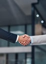 Strong handshake for a strong partnership. two businessmen shaking hands in a modern office. Royalty Free Stock Photo