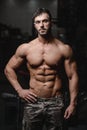 Strong and handsome athletic young man muscles abs and biceps Royalty Free Stock Photo