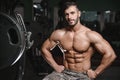 Strong and handsome athletic young man muscles abs and biceps Royalty Free Stock Photo