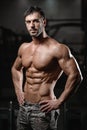 Strong and handsome athletic young man muscles abs and biceps Royalty Free Stock Photo