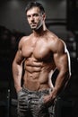 Strong and handsome athletic young man muscles abs and biceps Royalty Free Stock Photo