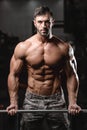 Strong and handsome athletic young man muscles abs and biceps Royalty Free Stock Photo