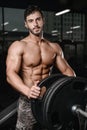 Strong and handsome athletic young man muscles abs and biceps Royalty Free Stock Photo