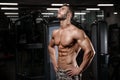 Strong and handsome athletic young man muscles abs and biceps Royalty Free Stock Photo