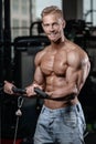 Strong and handsome athletic young man muscles abs and biceps Royalty Free Stock Photo