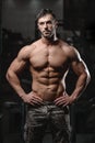 Strong and handsome athletic young man muscles abs and biceps
