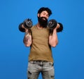 Strong handsome bodybuilder doing workout in fitness gym. Weight training. Sport equipment. Athletic muscular sportsman Royalty Free Stock Photo