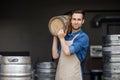 Strong handsome male brewery worker and industrial production