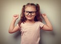 Strong happy successful girl showing muscular. Healthy child lif Royalty Free Stock Photo