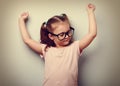 Strong happy successful girl showing muscular. Healthy child lif Royalty Free Stock Photo