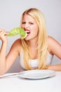 Strong healthy woman with lettuce