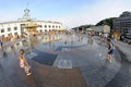 Strong heat in the city: people playing with fountain water jets at the square. Kyiv, Ukraine Royalty Free Stock Photo