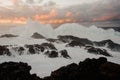 Strong and high foam sea wave and a lot of rocks Royalty Free Stock Photo