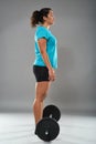 Strong hispanic woman doing deadlift Royalty Free Stock Photo