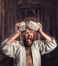 Strong karateka breaks a brick Royalty Free Stock Photo