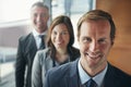 Strong leadership is essential for a high performing team. Portrait of a team of professionals standing together in an Royalty Free Stock Photo