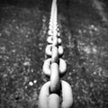 Strong link iron chain. Monochrome photo.