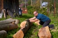 Strong lumberjack handling the logs Royalty Free Stock Photo