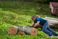 Strong lumberjack handling the logs Royalty Free Stock Photo