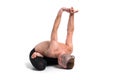 Strong male doing yoga on white background. Yoga poses for good