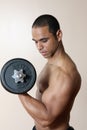 Strong male lifting dumbbell Royalty Free Stock Photo