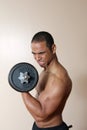 Strong male lifting dumbbell Royalty Free Stock Photo