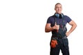 Strong male mechanic in blue overal standing on a white isolated background Royalty Free Stock Photo