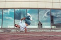 Strong man acrobat dancer, dancing breakdance, summer city, free space for text, hip hop dancer. Youth lifestyle, active Royalty Free Stock Photo